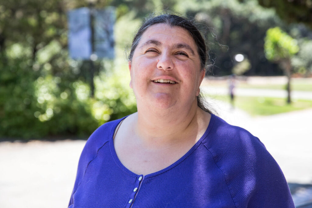 Lucy Greco with a big grin on a sunny day.